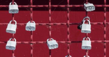locks on red fence