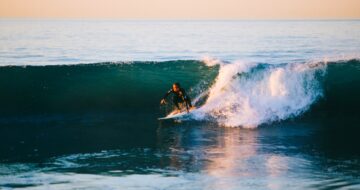man surfing wave