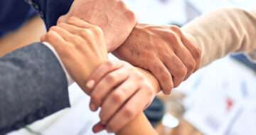 Hands bonding together emphasizing collaboration and partnership. Photo by krakenimages on Unsplash